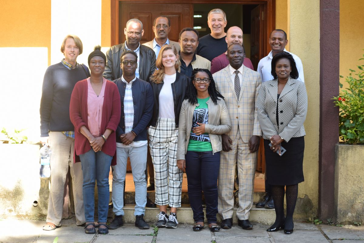 enlarge the image: Students and professors from Leipzig University and Addis Ababa University pose in front of the Institute for Peace and Security Studies.